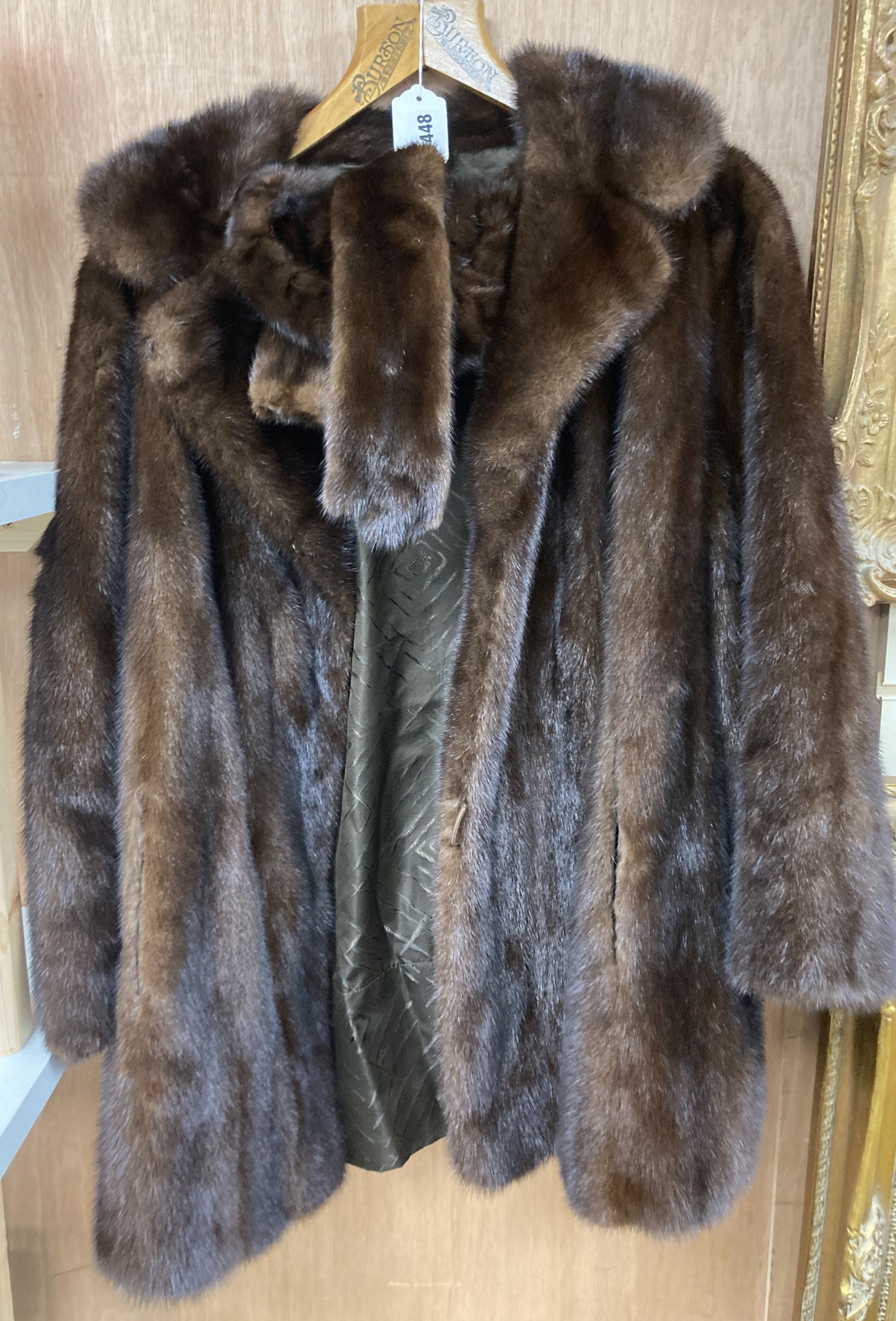 A brown mink fur coat, hat and ties